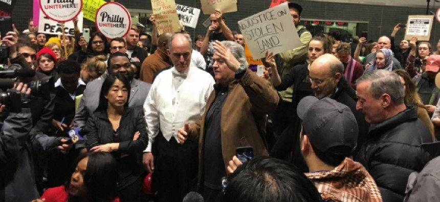 Protestors and prominent Democrats at the Philadelphia Airport. Photo by Dan Papa