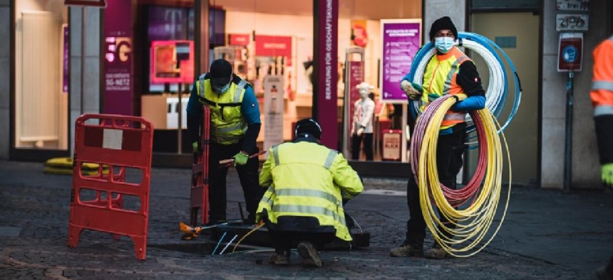 Technicians installing broadband pipes