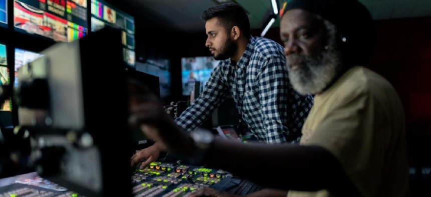 Broadcast engineers working in studio