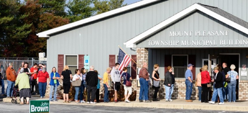 Voters in line waiting to cast their ballots in the 2016 election – Shutterstock
