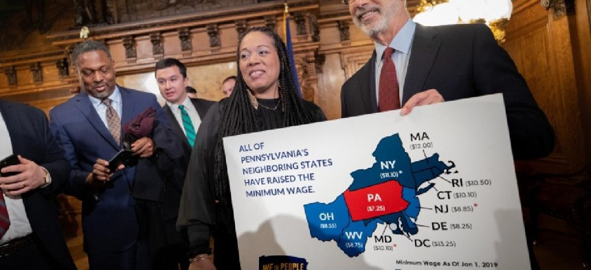 Gov. Tom Wolf with advocates in support of raising the minimum wage