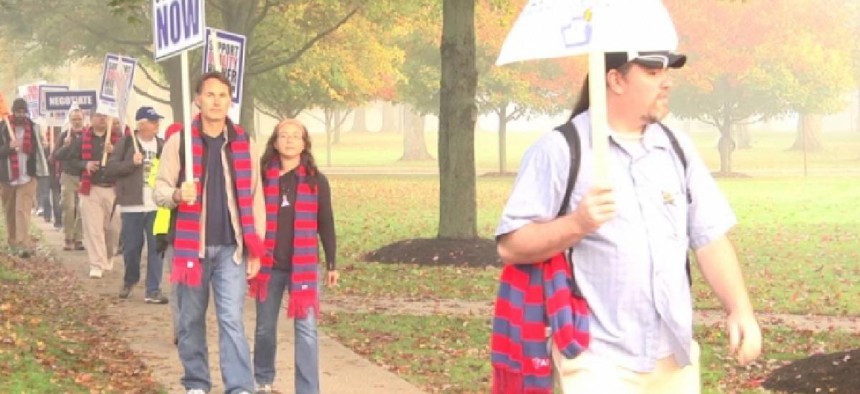 Strikers and protestors picket at Edinboro University for a new contract – image from YouTube