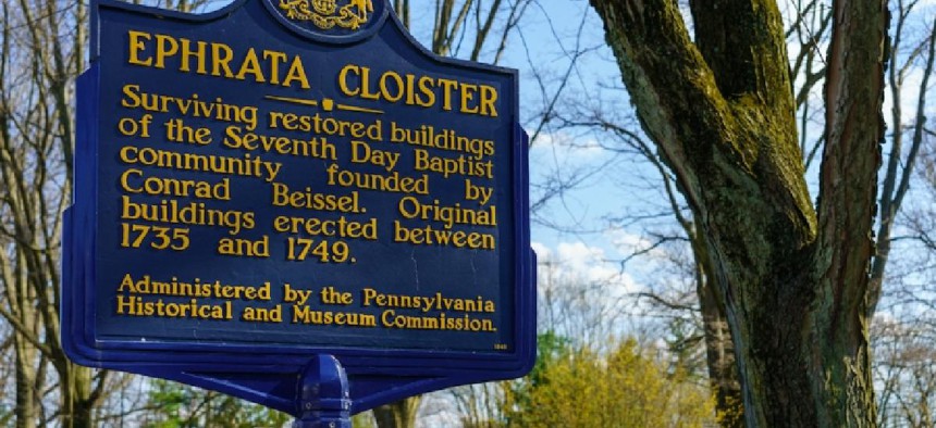 A historical marker sign at the historic 18th century Ephrata Cloister Museum in Lancaster County, PA.