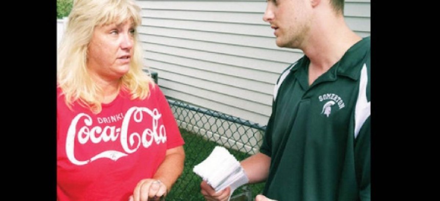 Seth Kaplan talks to a neighbor in a cached image from the Somerton Civic Association website.