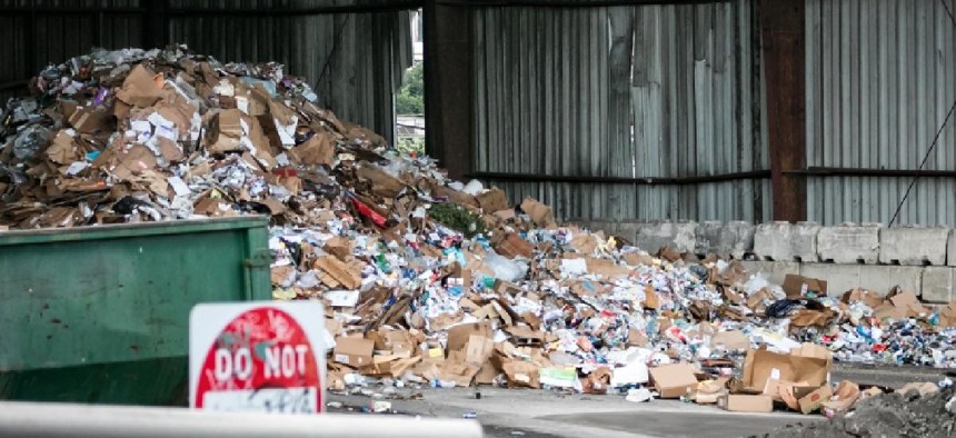A large pile of garbage and recyclables in a waste management facility in Philadelphia.