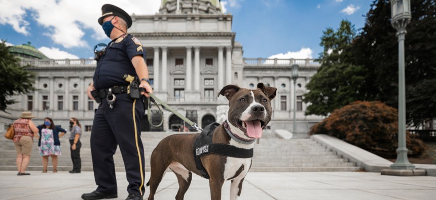 Police patrol outside the state Capitol in Harrisburg.