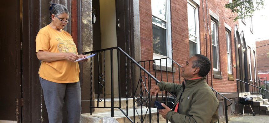 Committee person Justino Navarro canvasses his neighborhood.