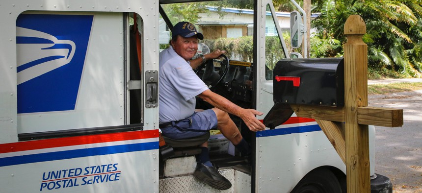 A postal worker makes his rounds.