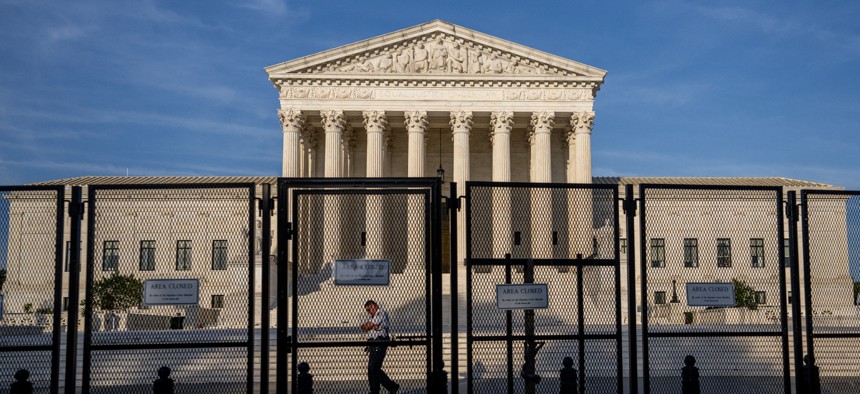 A police officer patrols the U.S. Supreme Court Building on June 21, 2022 in Washington, DC.