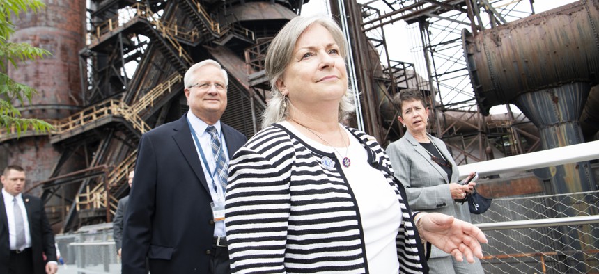 Rep. Susan Wild, Bethlehem Mayor Bob Donchez, and Kassie Hilgert, right, president of ArtsQuest, tour Levitt Pavilion Steelstacks while visiting area businesses with Secretary of Labor Marty Walsh, to discuss the American Jobs Plan in Bethlehem.