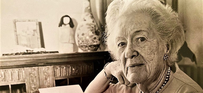 Augusta-born author Elizabeth Willis DeHuff as seen in 1972 at her typewriter. Behind her on the desk is a kachina doll.