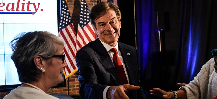 Mehmet Oz greets supporters after the primary race in May.