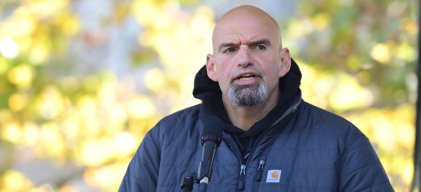 Democratic candidate for U.S. Senate John Fetterman addresses supporters during a joint rally with Democratic candidate for governor Josh Shapiro.