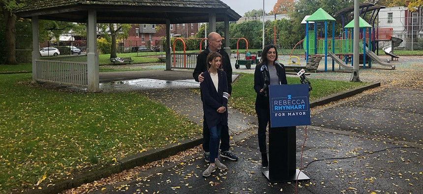 Rebecca Rhynhart, joined by her husband, David McDuff, and daughter, Julia Bright, kicks off her mayoral campaign in West Philly.