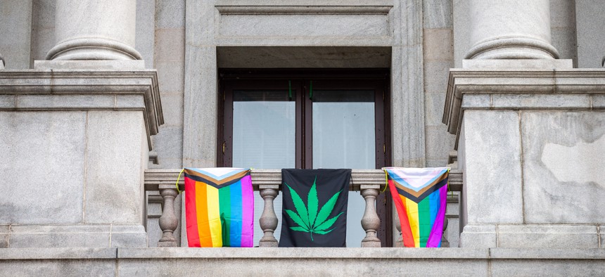 Flags hang from the balcony outside of former Lt. Gov. John Fetterman's office.