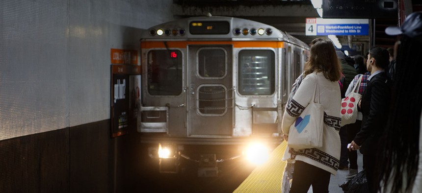 Commuters wait on the platform as a Northbound Broad Street Line train arrives at SEPTA City Hall subway station, in Center City, Philadelphia.