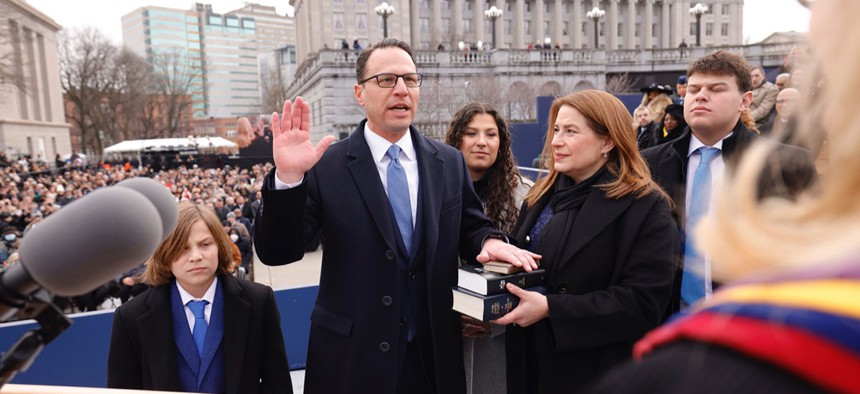 Gov. Josh Shapiro takes the oath of office at his inauguration ceremony.
