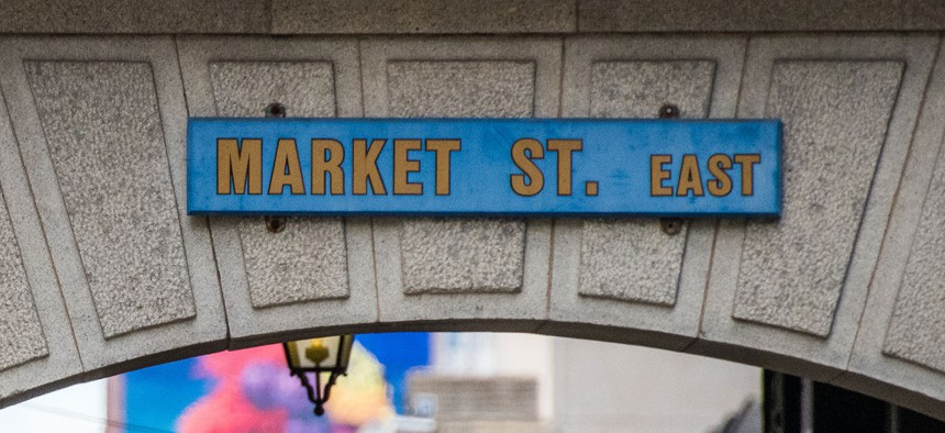 Market Street East sign on an arch in City Hall, Philadelphia.