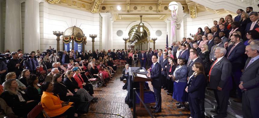 Gov. Josh Shapiro speaks during a press conference in the rotunda of the state Capitol.