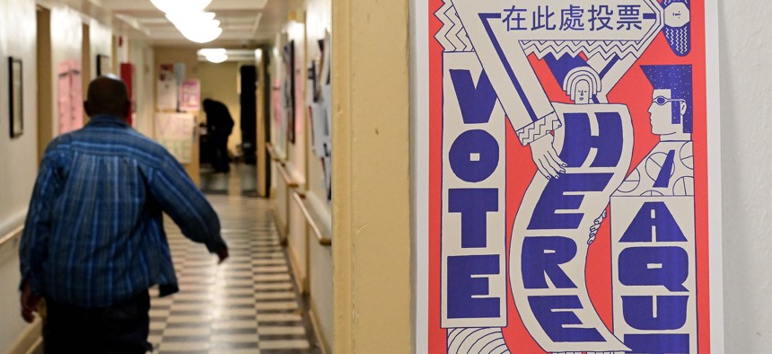 Voters arrive to cast their ballots at the Kendell Arms polling location on November 8, 2022 in Philadelphia.