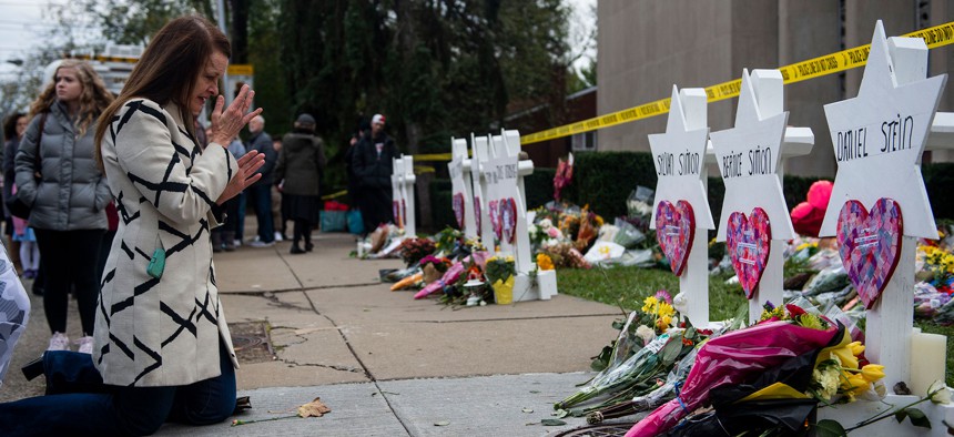 Mourners grieve outside the Tree of Life synagogue in Pittsburgh.