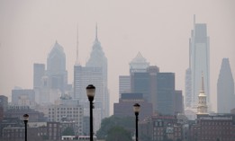 Smoke from Canada's wildfires casts a haze over the Philadelphia skyline.