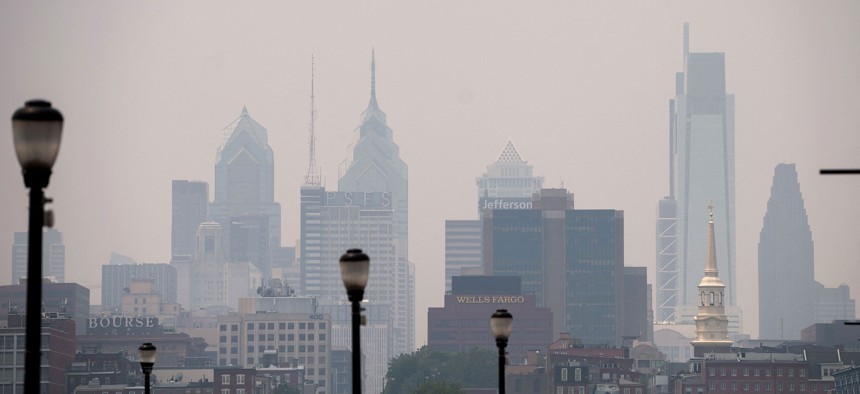 Smoke from Canada's wildfires casts a haze over the Philadelphia skyline.