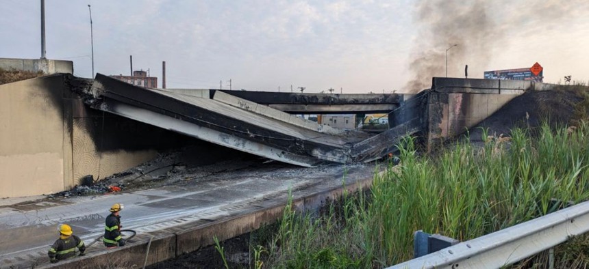 Smoke rises from a collapsed section of the I-95 highway on June 11, 2023 in Philadelphia.