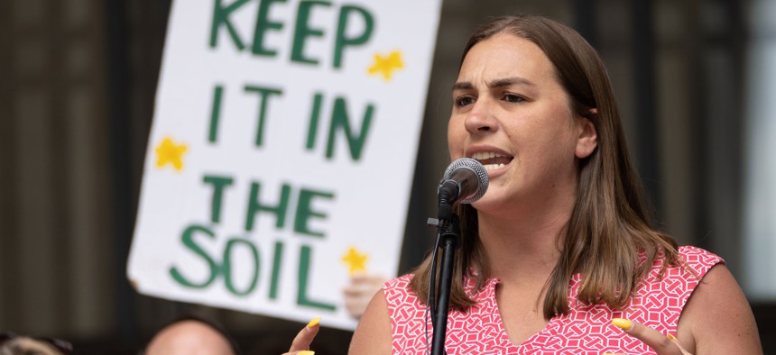 Bethany Hallam speaks at a rally to demand County Council pass a bill to ban fracking in County parks in June 2022.