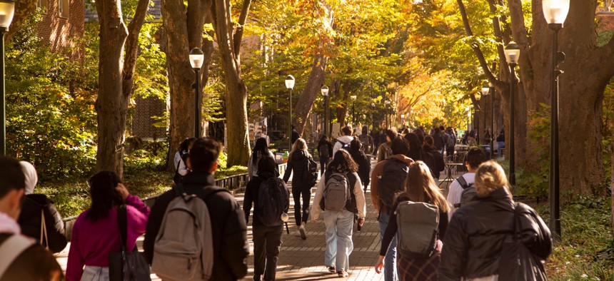 Students walk along Locust Walk at the University of Pennsylvania.
