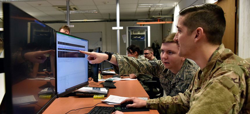 Cyber airmen analyze information systems for potential malicious activity