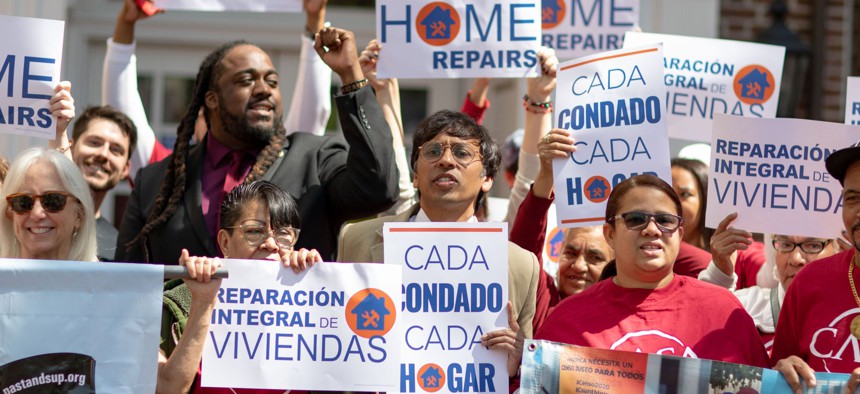 Lawmakers and advocates rally in support of the Whole-Home Repairs program. 
