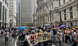 Protesters take to the streets around Philadelphia City Hall to oppose a proposed arena for the Philadelphia 76ers that opponents believe would endanger the city's beloved Chinatown.