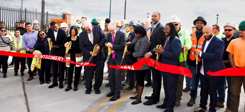 Among those involved in the ceremonial ribbon-cutting for the reopening of Philadelphia’s Montgomery Avenue Bridge were, second from left, Councilmember Jeffery Young, Mayor Cherelle Parker and Tom Perez, Senior Advisor and Assistant to the President and Director of the White House Office of Intergovernmental Affairs.