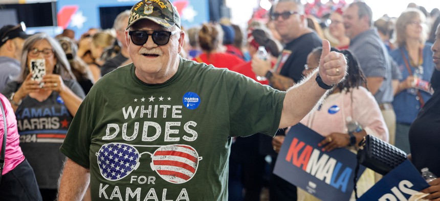 A supporter wears a “White Dudes for Kamala Harris” at a Harris campaign rally in Michigan on Aug. 7, 2024.