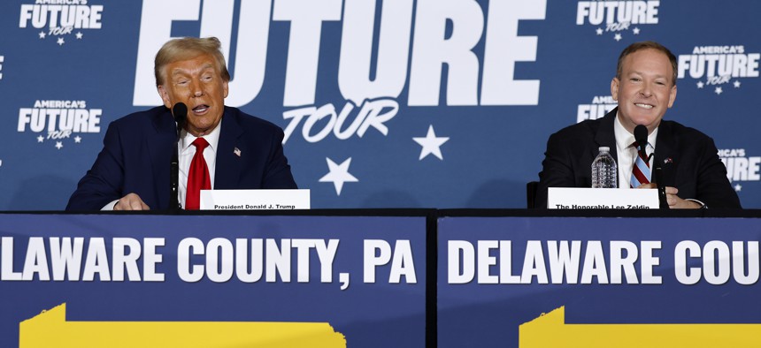 Republican presidential nominee, former U.S. President Donald Trump (L) participates in a roundtable discussion with former Republican U.S. Representative from New York Lee Zeldin at the Drexelbrook Catering & Event Center on October 29, 2024 in Drexel Hill, Pennsylvania