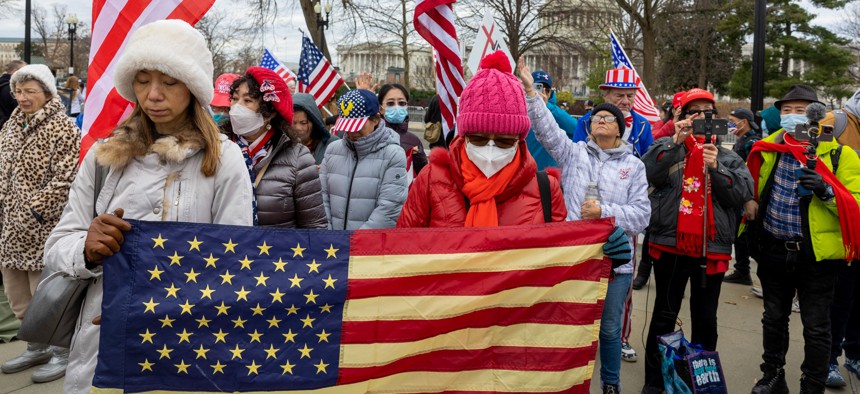 Supporters of protesters arrested on Jan. 6, 2021 protest outside the U.S. Supreme Court.