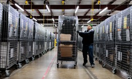 A Board of Election employee moves election equipment and supplies to be loaded and distributed to polling locations in Bucks County at a warehouse on Oct. 29, 2024 in Doylestown.