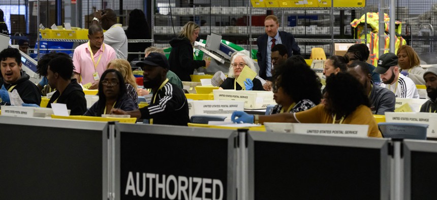 Philadelphia county board of elections staff processing ballots on Election Day at the ballot counting elections warehouse on the outskirts of Philadelphia.