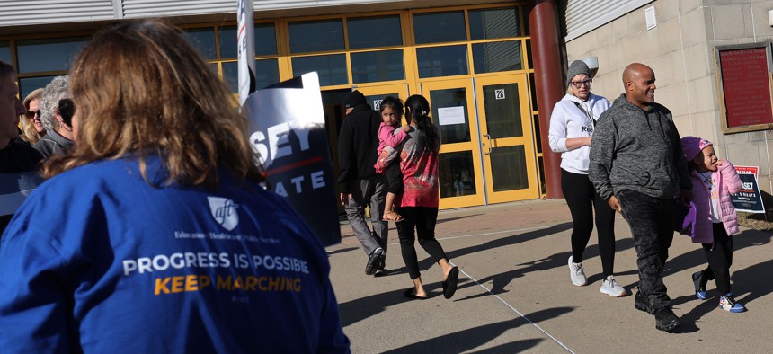 People arrive to vote on Election Day at Scranton High School on November 05, 2024 in Scranton, Pennsylvania.