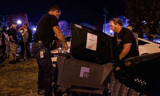 Workers deliver an additional voting machine to the polling location in the Banana Factory in the 3rd Ward of Bethlehem, Pennsylvania on November 5, 2024.