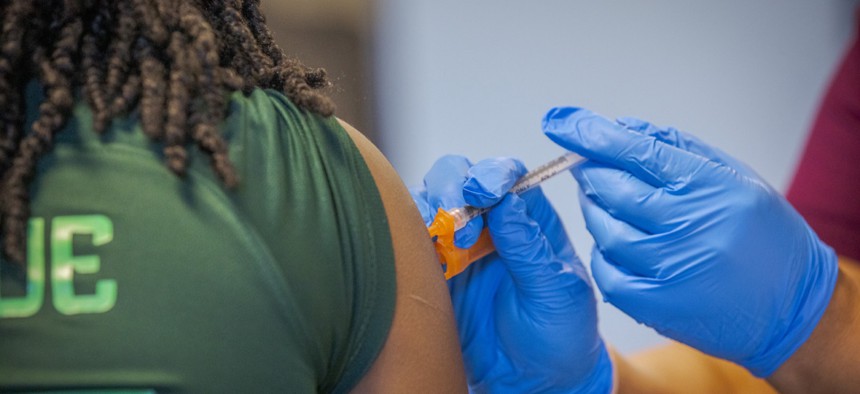 A nurse administers a vaccination at a vaccine clinic in Harrisburg, Pennsylvania in July 2022.