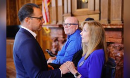 Gov. Josh Shapiro speaks with Eileen Miller at a bill signing ceremony in June 2024.