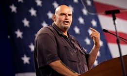 Sen. John Fetterman speaks at a rally for Democratic vice presidential nominee Minnesota Gov. Tim Walz at the York Exposition Center UPMC Arena in October.