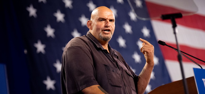 Sen. John Fetterman speaks at a rally for Democratic vice presidential nominee Minnesota Gov. Tim Walz at the York Exposition Center UPMC Arena in October.