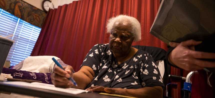Joyce King receives a new ballot at her nursing home on Sunday, Nov. 3, 2024 in South Philadelphia.