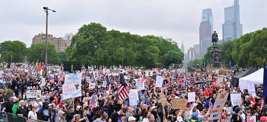 People protest in Philadelphia as part of the No Kings Rallies on June 14, 2025