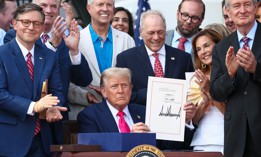 President Donald Trump, joined by Republican lawmakers, signs the One, Big Beautiful Bill Act into law on July 4, 2025 in Washington, DC.