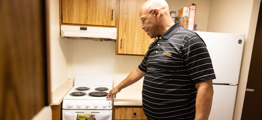 Nate Cornelious in the kitchen of the apartment he secured through Allegheny County’s 500 in 500 program.