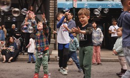 Children play on a Philadelphia street closed down as part of Center City District’s Open Streets initiative.